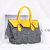 Gray cashmere with yellow ostrich leather flap tote