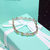 Tiffany & Co. Gold cross silver rhinestone bracelet