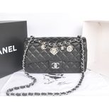 Chanel Original black leather camellia charm flap bag